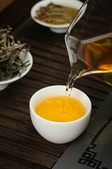 Pouring Fresh Green Tea from Glass Teapot - Traditional Chinese Tea Ceremony with Longjing Leaves
