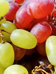 Ripe grapes of different varieties on a plate
