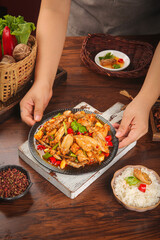 Spicy Stir-Fried Chicken and Vegetables in Cast Iron Skillet with Rice - Asian Cuisine Meal