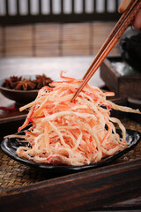 Dried Shredded Squid Seafood Snack with Chopsticks Asian Specialty Food Studio Shot
