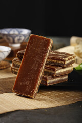 Handmade Brown Sugar Cane Chunks on Bamboo Mat - Traditional Natural Sweetener Blocks