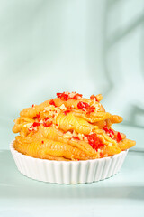 Spicy Marinated Boneless Chicken Feet with Red Peppers in White Bowl - Traditional Asian Cuisine