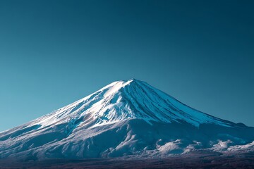 Majestic Mount Fuji covered in pristine snow shimmers against a serene blue sky, offering a sense of peace and inspiring travel dreams for your next adventure