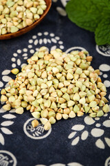 Raw Buckwheat Grains Healthy Gluten-Free Cereal Triangle Seeds in Rustic Farmhouse Kitchen Setting