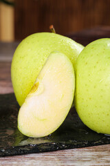 Fresh Xinjiang Wanglin Apples - Sweet Imported Green Apples with Slice on Slate