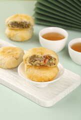 Traditional Chinese Dim Sum Pastries with Tea - Delicious Baked Puff Pastry Asian Cuisine