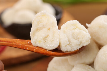 Hot Fresh Shrimp and Beef Balls on Wooden Spoon - Traditional Asian Dumpling Ingredients for Hot Pot Cooking