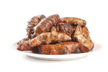 Fresh Ginger Roots on White Plate - Natural Spice and Health Ingredient