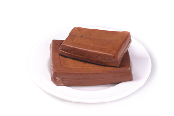 Dried Bean Curd Tofu Blocks on White Plate - Traditional Chinese Szechuan Style Protein Food Ingredient