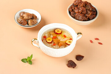 Asian Sweet Soup with Dates Lychee and Fungus in Silver Bowl Traditional Chinese Dessert