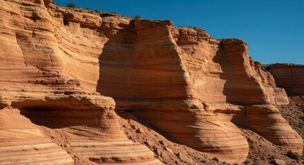 Terracotta cliffs, layered rock formations, desert landscape under sunny sky
