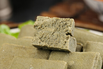 Yunnan Black Bean Tofu Snacks on Rustic Burlap - Traditional Asian Vegetarian Food Ingredients