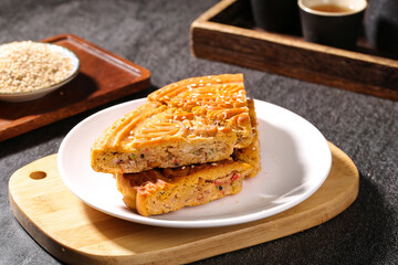 Traditional Chinese Five Kernel Mooncake Slices with Tea Setting for Mid-Autumn Festival Celebration