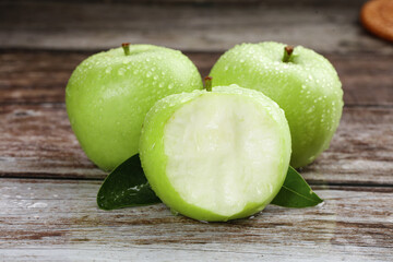 Fresh Green Apples with Water Drops on Wooden Background - Healthy Organic Fruit
