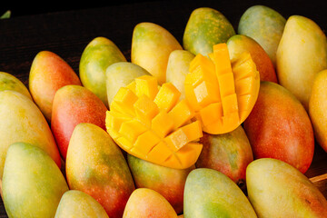 Colorful Ripe Mango Collection with Cubed Fresh Fruit Display