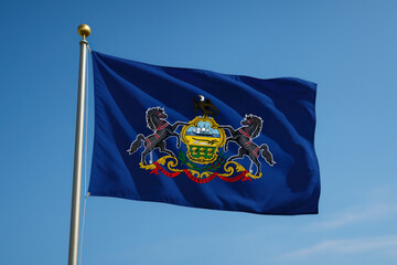 Pennsylvania state flag with coat of arms waving in the wind

Official flag of Pennsylvania featuring horses, eagle, and motto