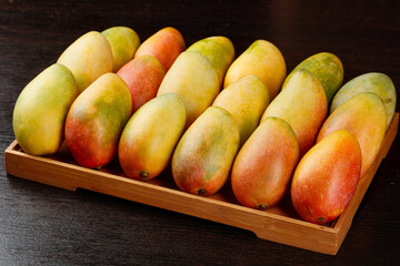 Fresh Ripe Hainan Sweetheart Guifei Mangoes in Wooden Tray - Tropical Fruit Display