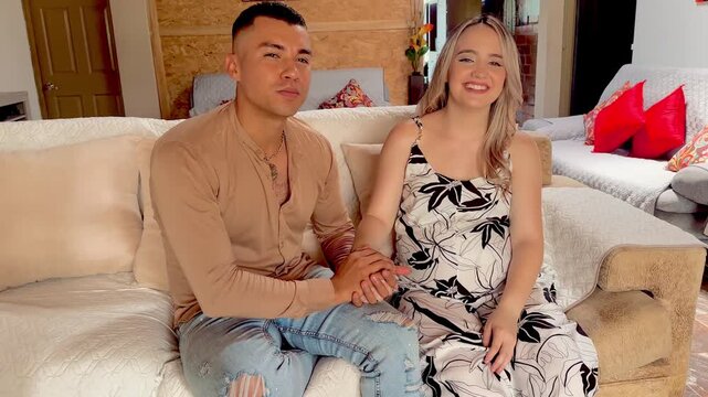 Colombian couple shares tender smile after looking at each other, moment of complicity and love