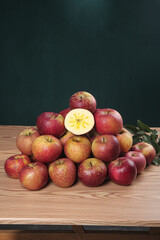 Fresh Red Apples with Cut Half Showing Star Core Pattern on Wooden Table