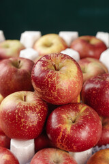 Fresh Red Apples in Protective Packaging Display for Market Sale