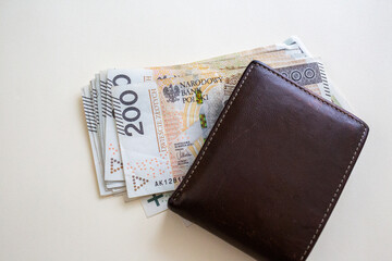 Polish złoty banknotes sticking out of wallet