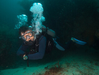 Alone diver in deep sea water.