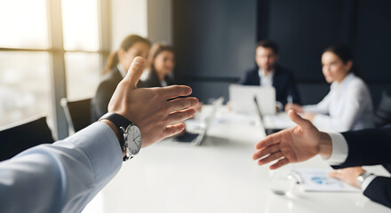 POV: reaching out to shake hands in a business meeting
