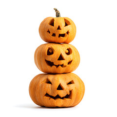 Stack of three carved halloween jack o lantern pumpkins isolated on white background