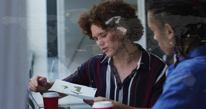 Curly-haired man sliding bar-chart sheet toward peer, world map overlay animating business analysis