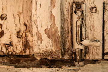 Old window lock. Peeling wood.