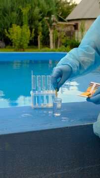 take a water sample from the pool. Selective focus.