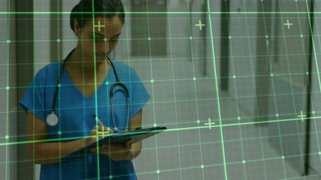 Nurse grabbing pen and writing notes in hospital with green overlay, pausing smiling and resuming