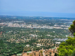 The harbor area and city center. General plan. Roofs of buildings. At home from a height. Aerial view of buildings with roofs. Streets with traffic in overhead view. Alanya castle walls.