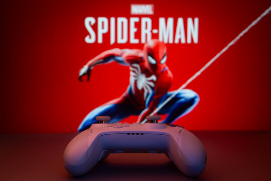 Dhaka, Bangladesh- 13 Sep 2025: Game controller in front of  Marvel&rsquo;s Spider Man on a background.