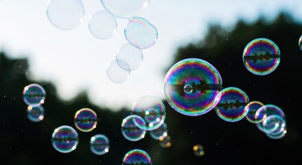 Colorful soap bubbles dancing in the air, reflecting the sunlight
