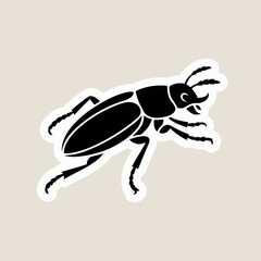 Black silhouette of a stag beetle on a light beige background