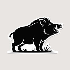 Black silhouette of a wild boar standing in grass with tusks visible