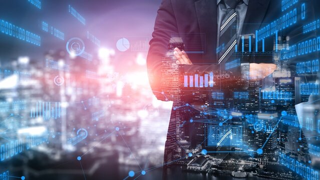 A businessman stands confidently in front of a vibrant cityscape, showcasing digital data and graphical analytics that represent growth and technology in finance. Xenic - Powered by Adobe