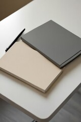 Fototapeta premium Notebook and pen placed on table for writing or note taking