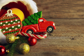 Saint Nicholas day tradition. Sweets and festive decor on wooden table, closeup. Space for text