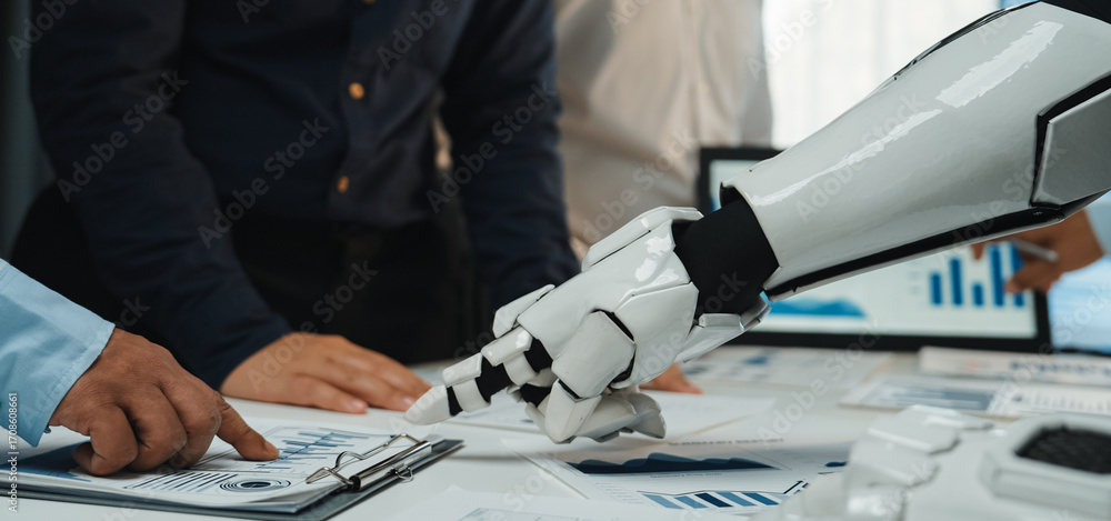 Poster a modern business meeting illustrating a robot hand shaking a human hand, showcasing teamwork and te
