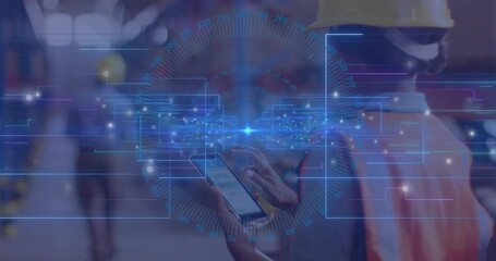 Warehouse worker scrolling smartphone with pulsing network, scanning area as coworker walking by - Powered by Adobe