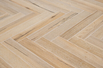 Wood like floor tiles arranged in herringbone pattern