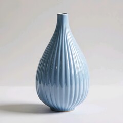 Title:
Blue ceramic vase with teardrop shape and vertical grooves