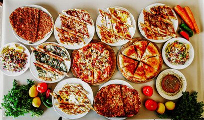 Delicious meat kebab with fresh vegetable salad served with variety of Turkish dishes and...