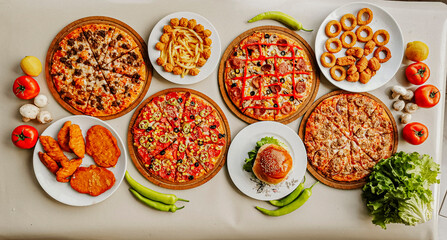 Delicious meat kebab with fresh vegetable salad served with variety of Turkish dishes and appetizers. Top view of assorted Turkish food and meze, tasty and healthy Mediterranean cuisine. Top view.