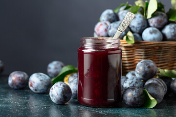 Ripe plums with jam on the kitchen table.