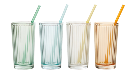 Four tall ribbed glasses with straws isolated on transparent background
