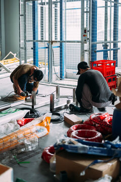 A worker cutting metal