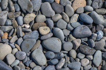 Sea stones on the beach as natural background